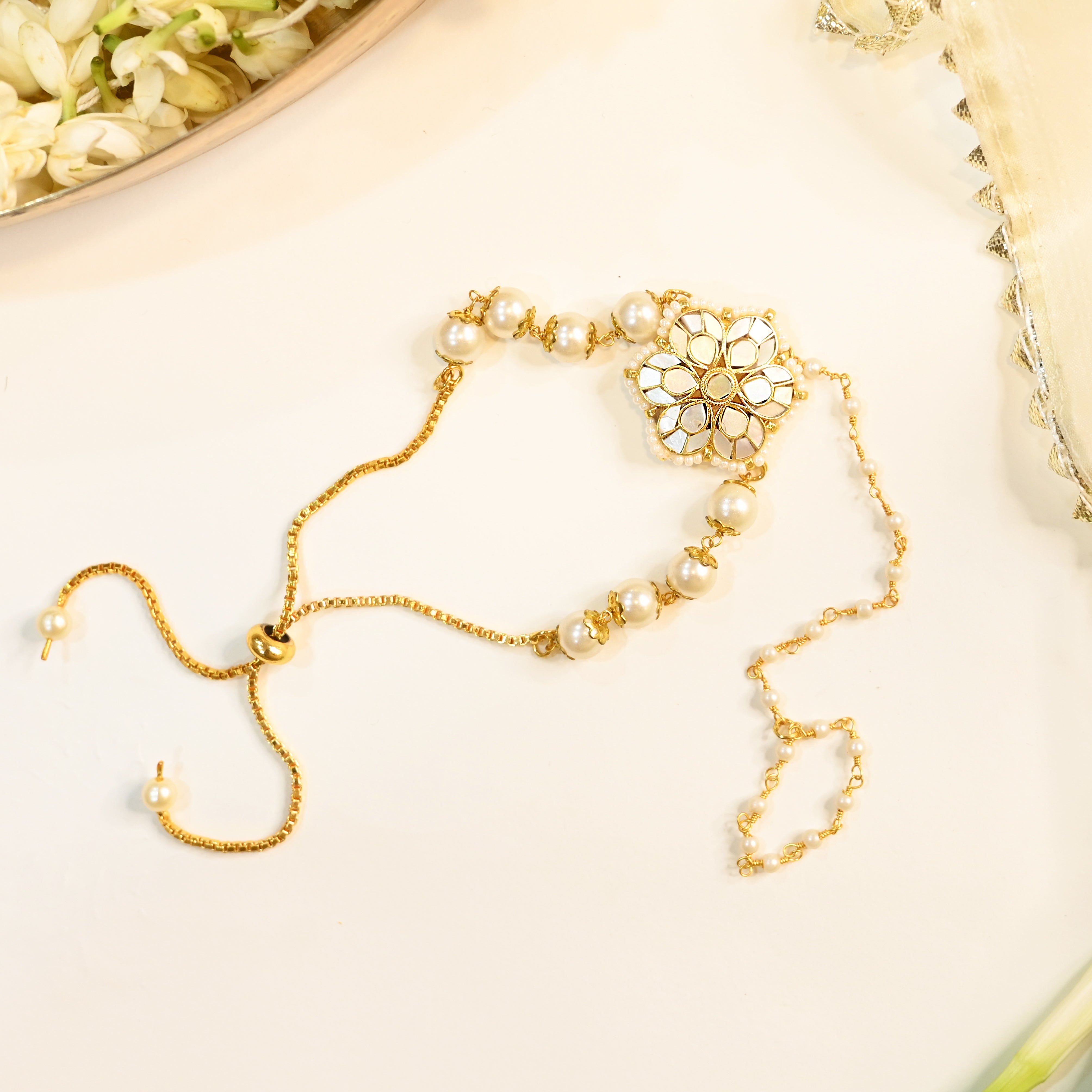 SJRB1027- White Colour Gold Plated Mother of Pearl Rakhi