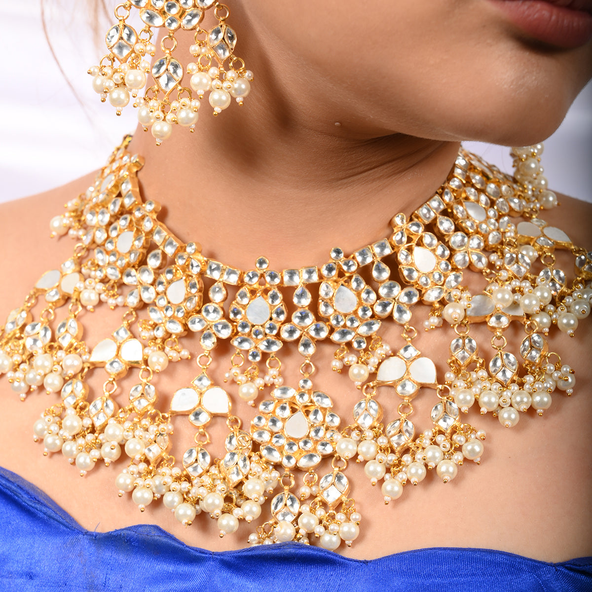 Vrishti Gold Plated Kundan Necklace With Earrings and Tika