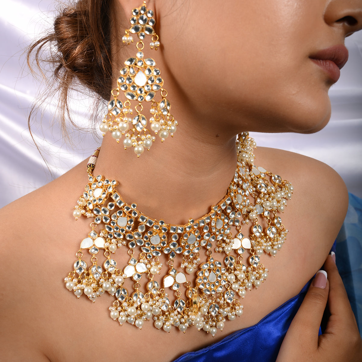 Vrishti Gold Plated Kundan Necklace With Earrings and Tika