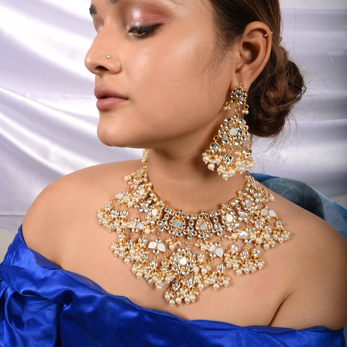 Vrishti Gold Plated Kundan Necklace With Earrings and Tika