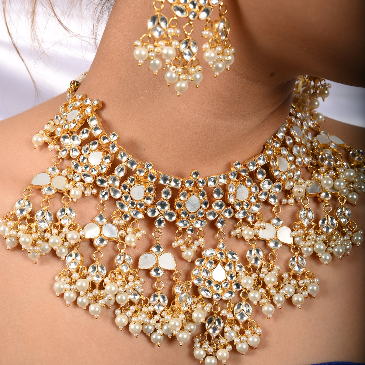 Vrishti Gold Plated Kundan Necklace With Earrings and Tika