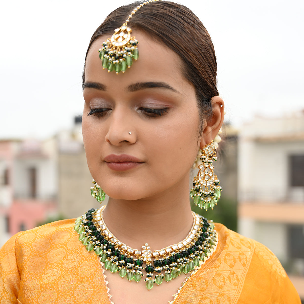 Baani Green Kundan Necklace Set with Tika