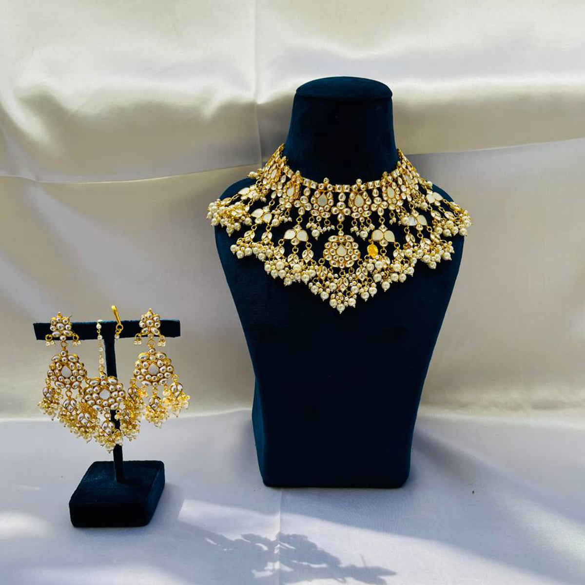 Vrishti Gold Plated Kundan Necklace With Earrings and Tika