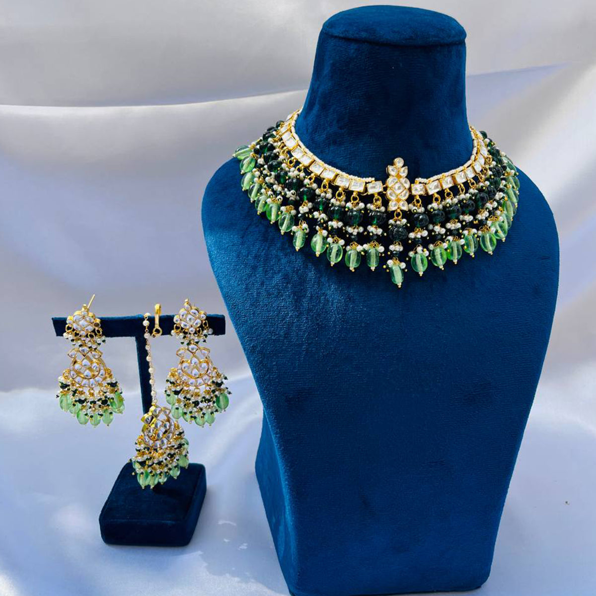 Baani Green Kundan Necklace Set with Tika