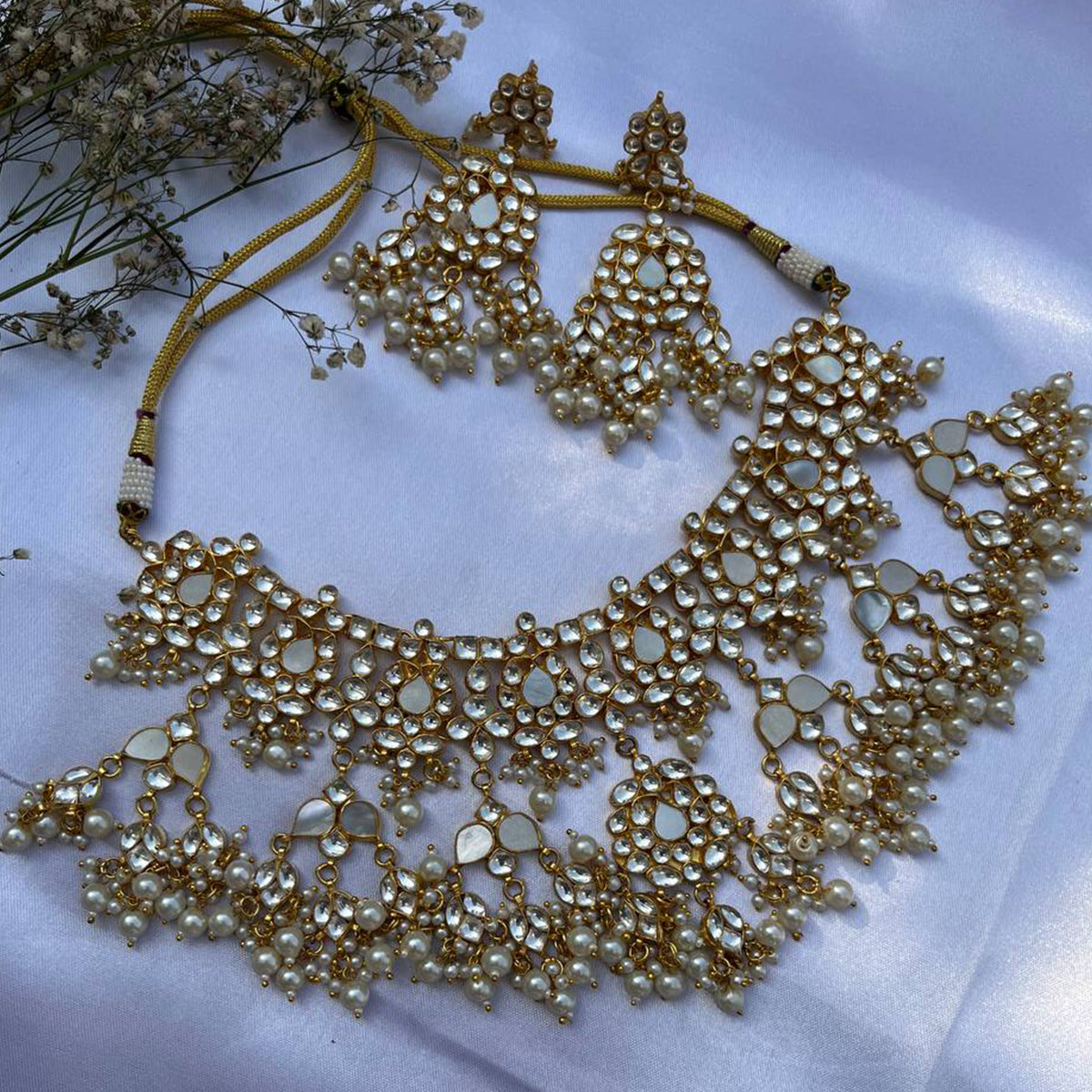 Vrishti Gold Plated Kundan Necklace With Earrings and Tika