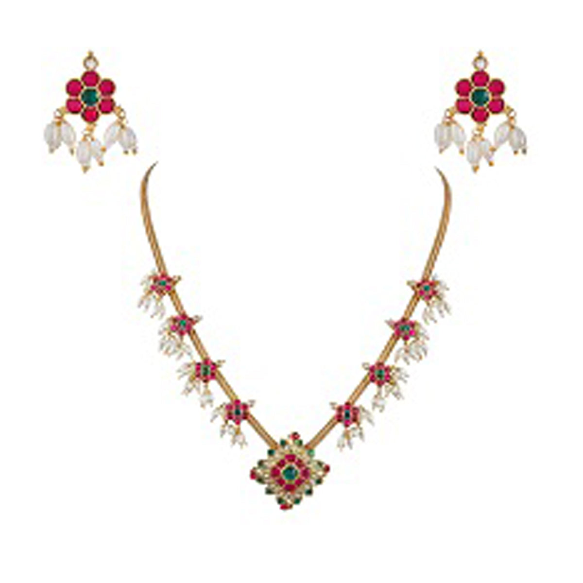 A gold-plated kundan necklace with red and green stone accents and a floral pattern, accompanied by matching earrings, against a white background.