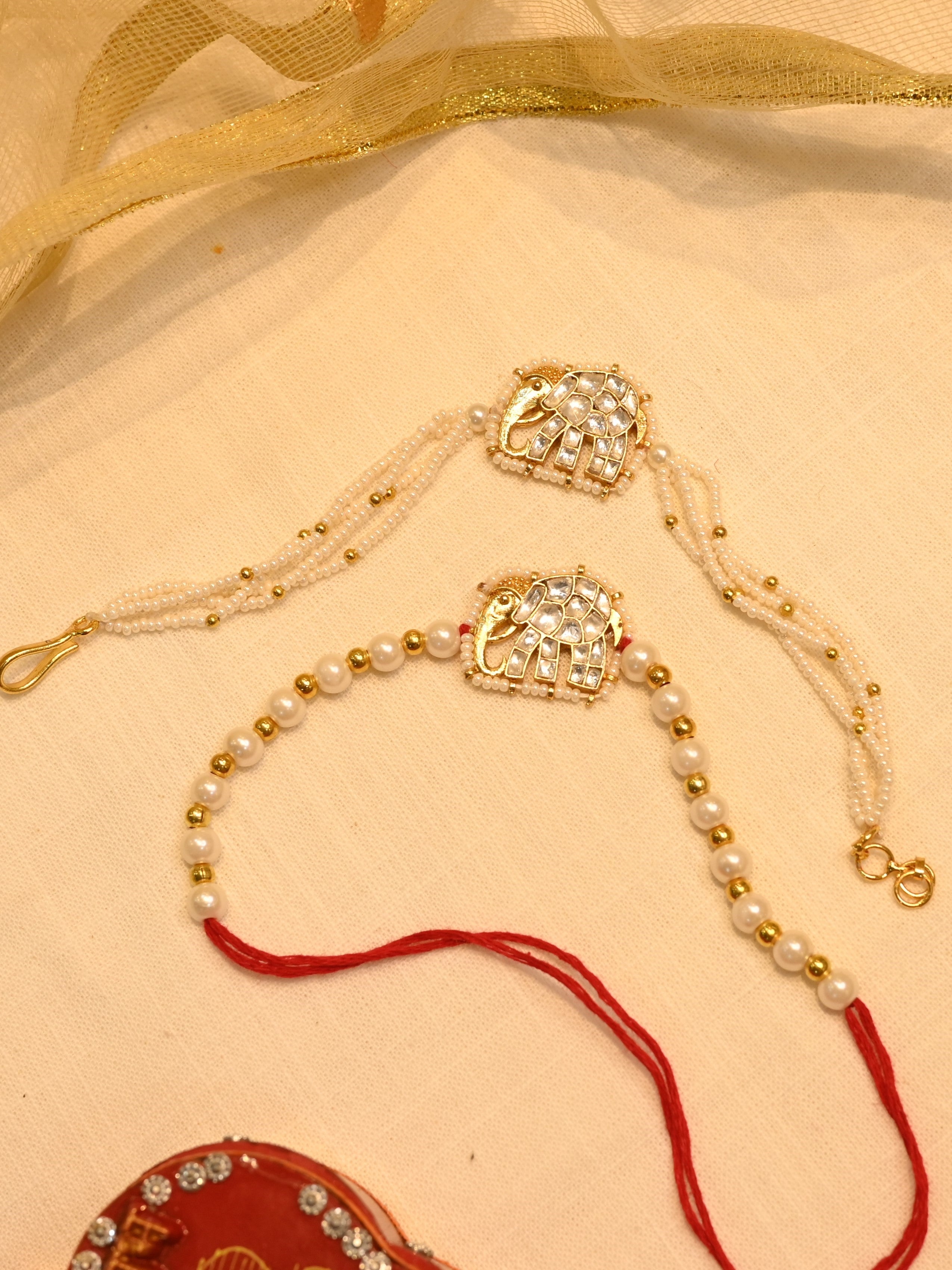 SJRB1011- white Colour Gold Plated Jadau Kundan Couple Elephant Motif Rakhi