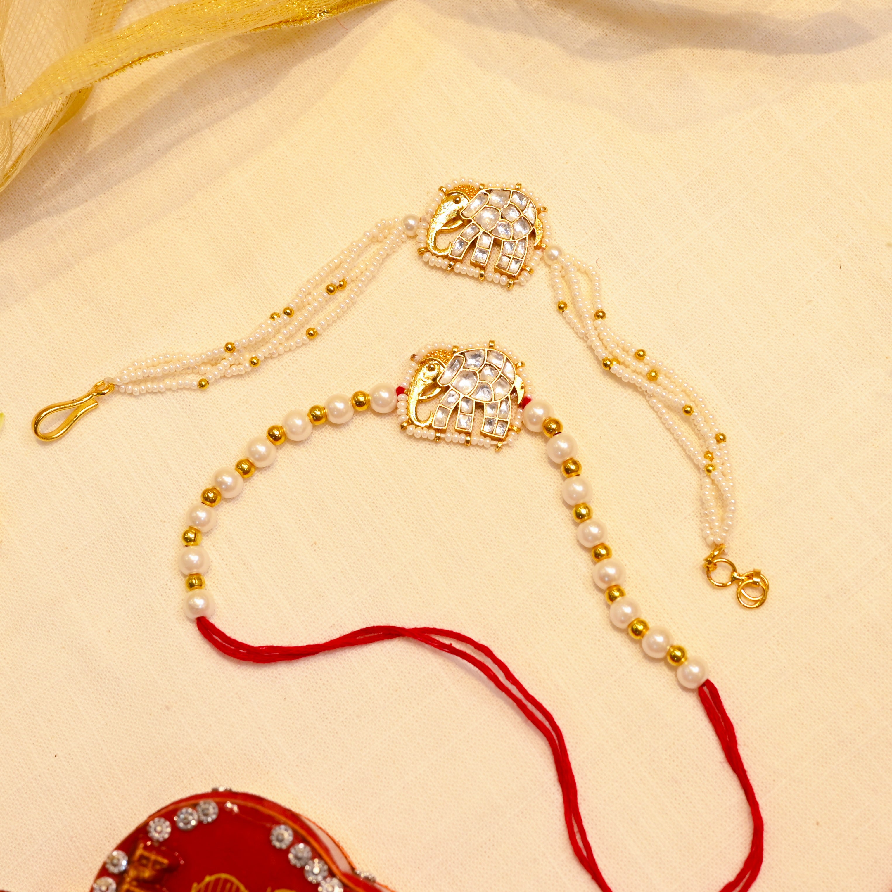 SJRB1011- white Colour Gold Plated Jadau Kundan Couple Elephant Motif Rakhi