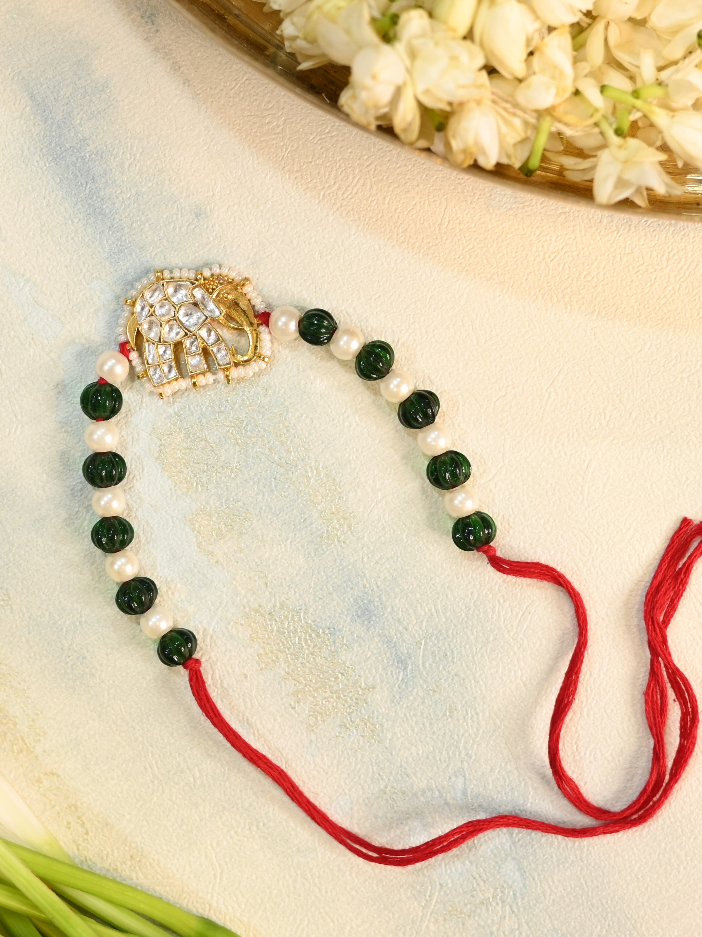 SJRB1015- White and Green Colour Gold Plated Jadau Kundan Elephant Motif Rakhi