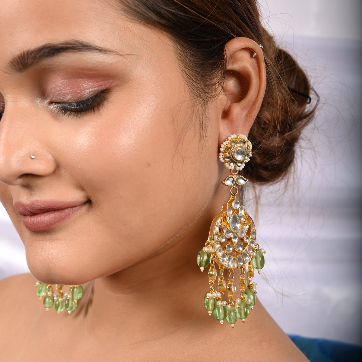 Kaushtubh Long Green Earrings