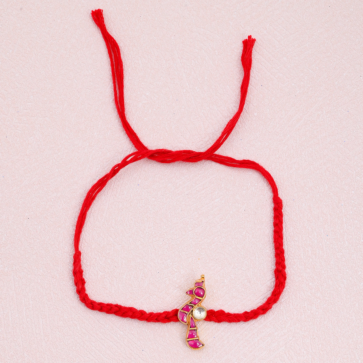 Prathith Gold Plated Pink Peacock Kundan Rakhi